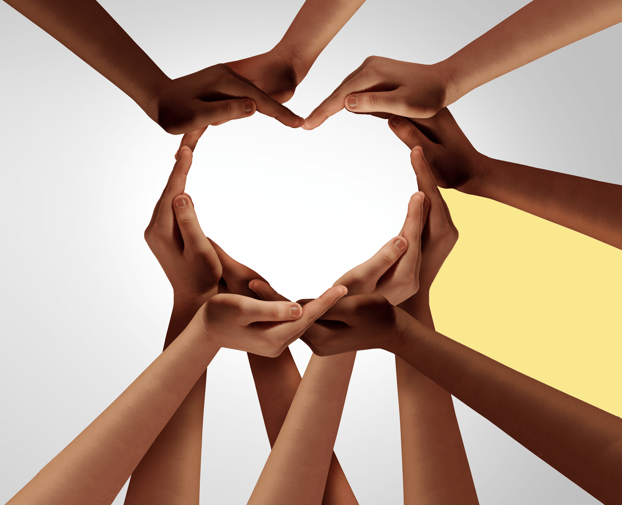 Unity and diversity partnership as heart hands in a group of diverse people connected together shaped as a support symbol expressing the feeling of teamwork and togetherness